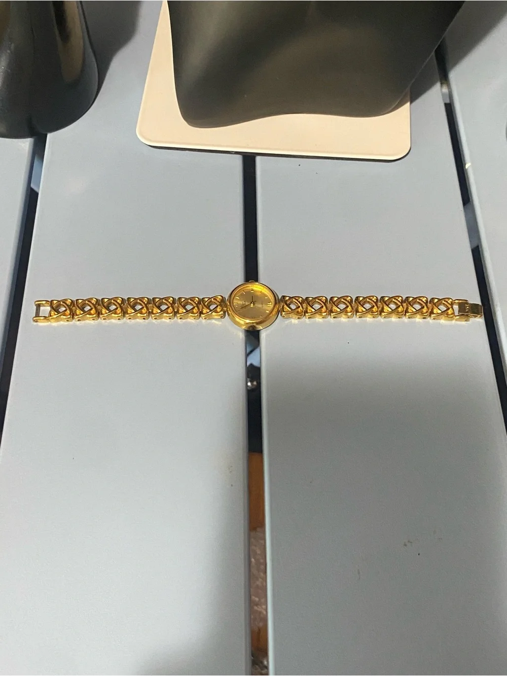 Decan De La Renta gold tone designer watch